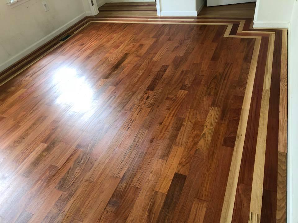 Finished hardwood floor with decorative border